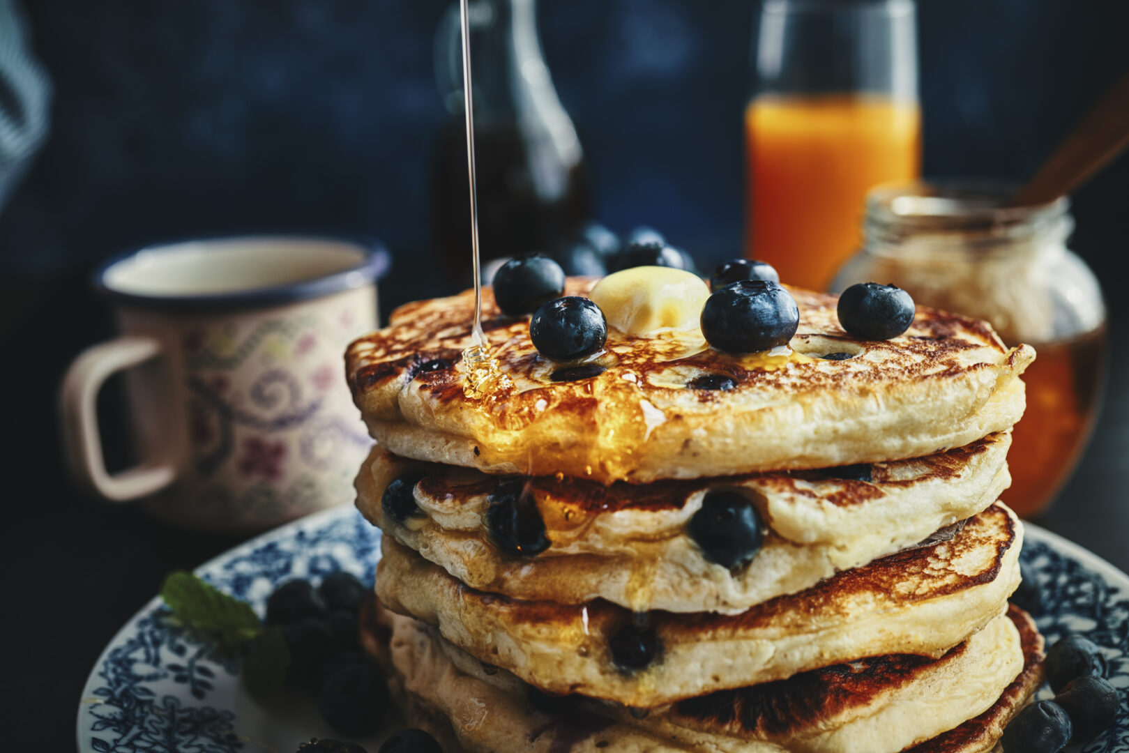 Stack of Pancakes with Maple Syrup and Fresh Blueberries